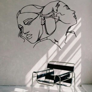 Cuadro de doble rostro femenino en línea continua, siluetas contrastadas en negro, arte decorativo moderno para pared interior.